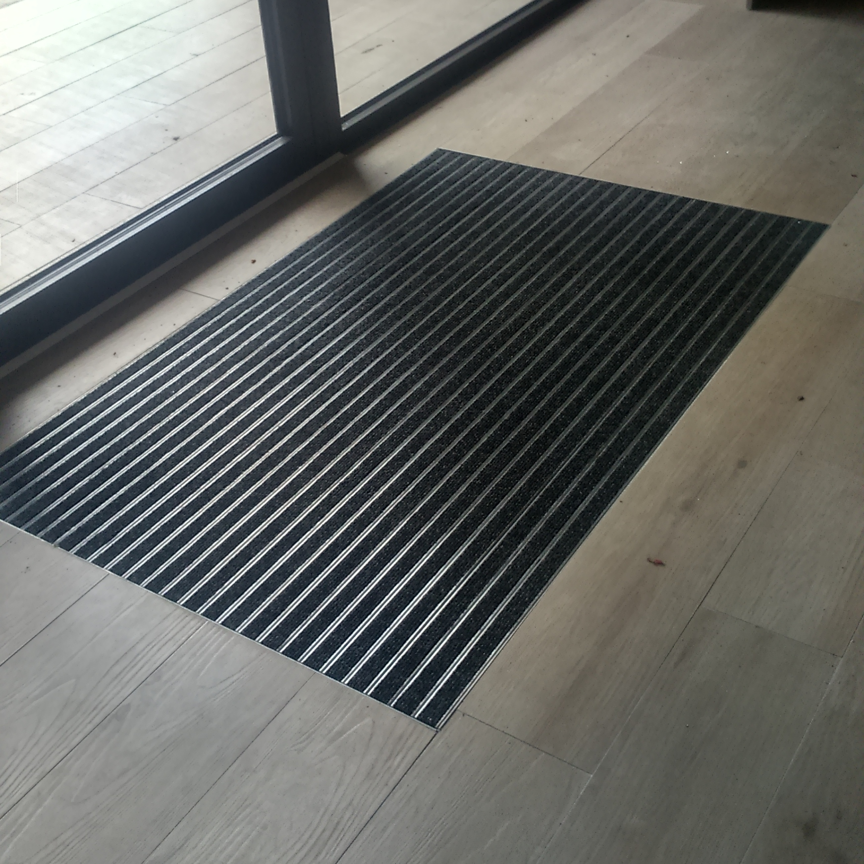 Pose de paillasson - imitation parquet