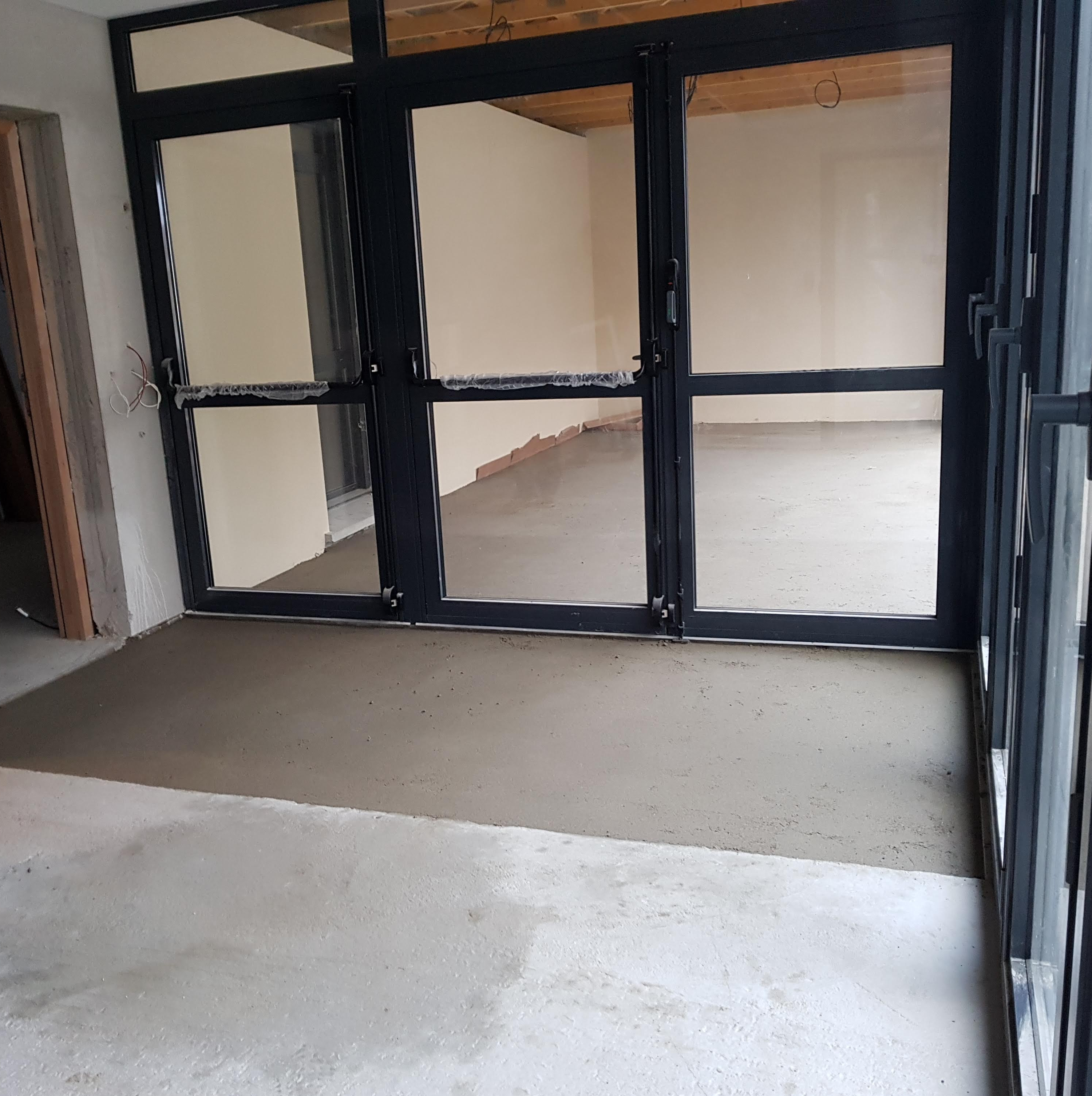 Réalisation d'un hall d'entrée - chape talochée